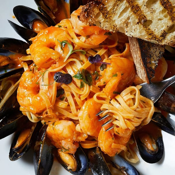 All Set Restaurant & Bar's seafood pasta with shrimp, mussels, and toasted bread.