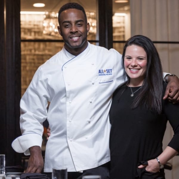All Set Restaurant & Bar's Chef Edward Reavis in a chef coat with a woman.